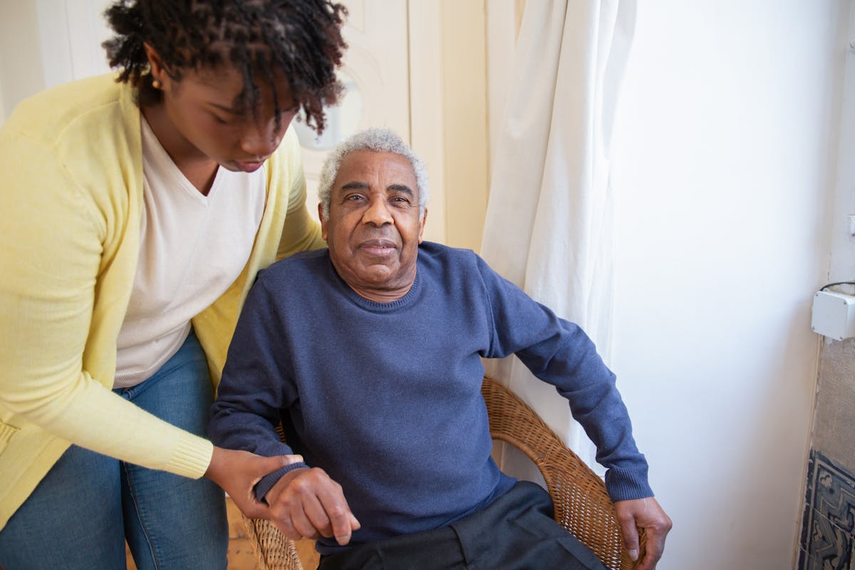 Elderly person exercising with a physiotherapist